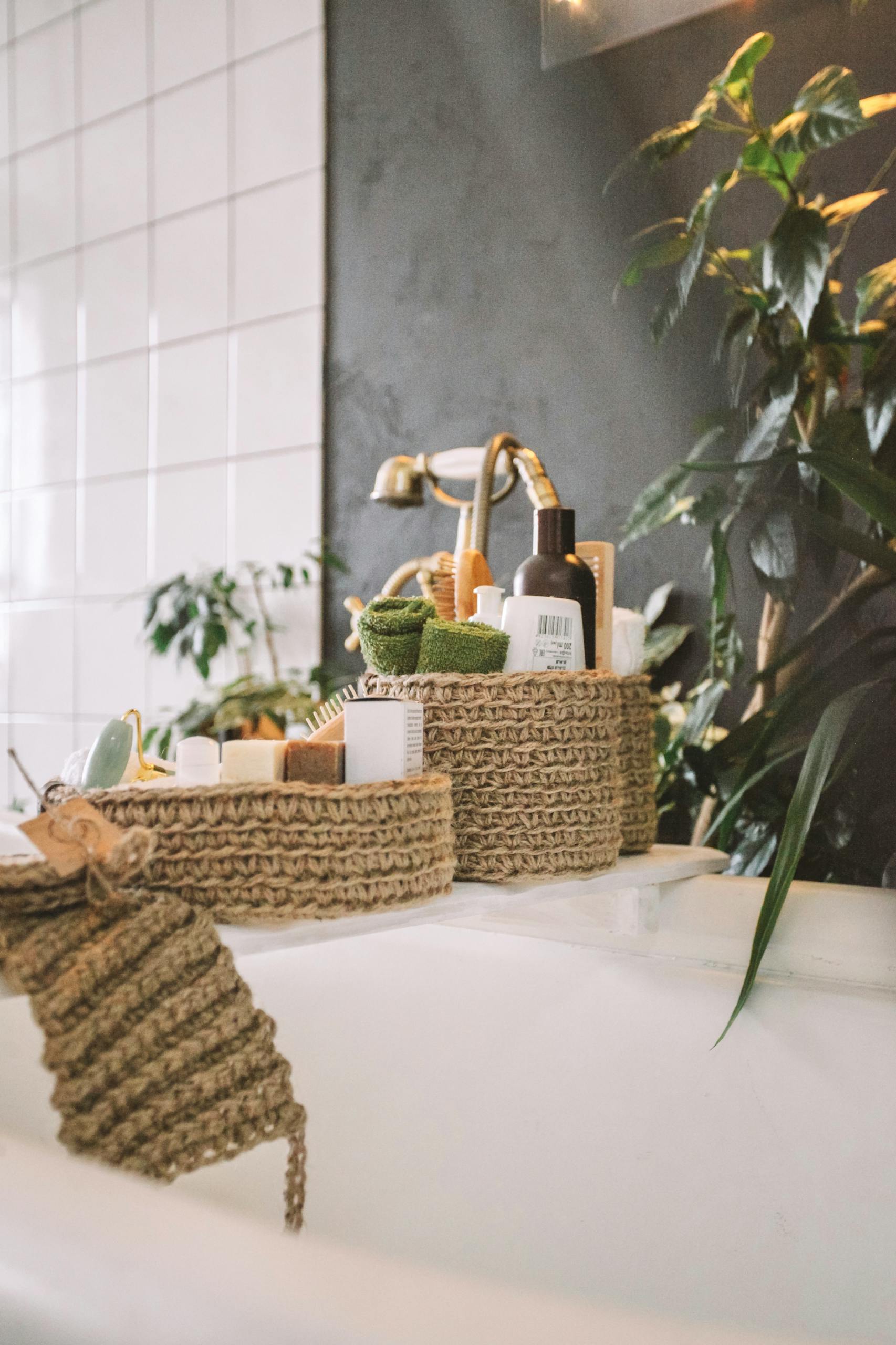 A cozy bathroom with natural bath essentials, knitted organizers, and lush plants.